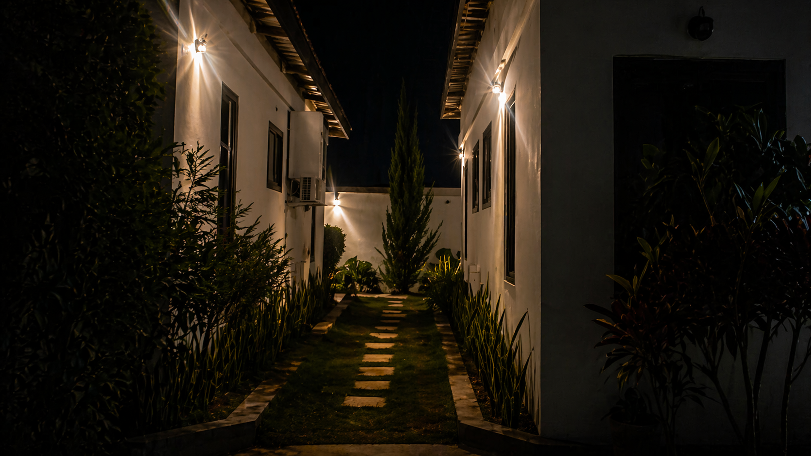 CAPIE Lodges night view with lit walkway
