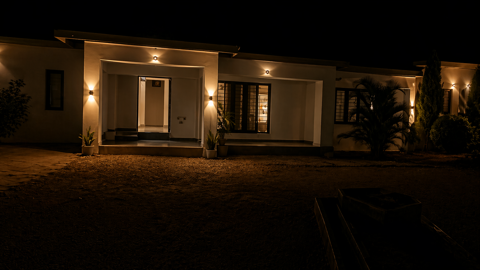 Quiet garden view at CAPIE Lodges after dark